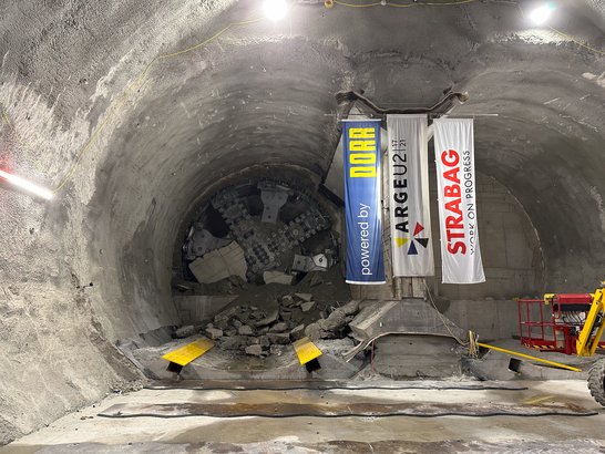 Tunnel construction with consortium flags and tunnel boring machine